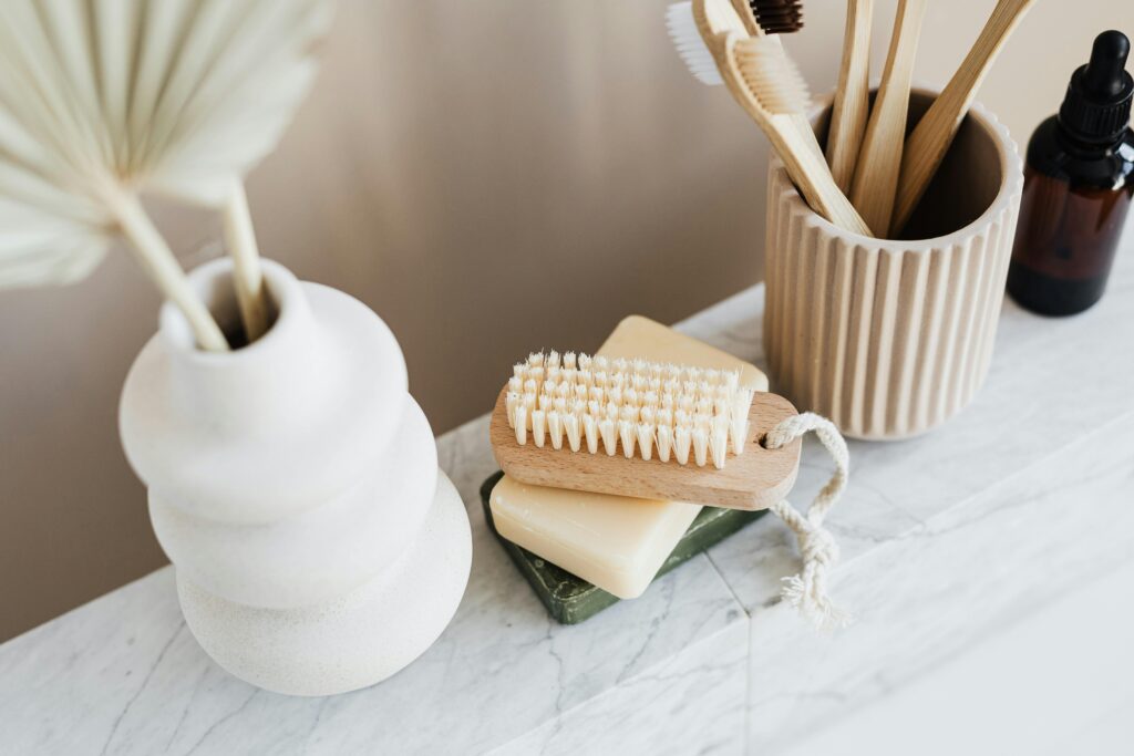 Minimalist bathroom layout featuring sustainable hygiene products on marble.